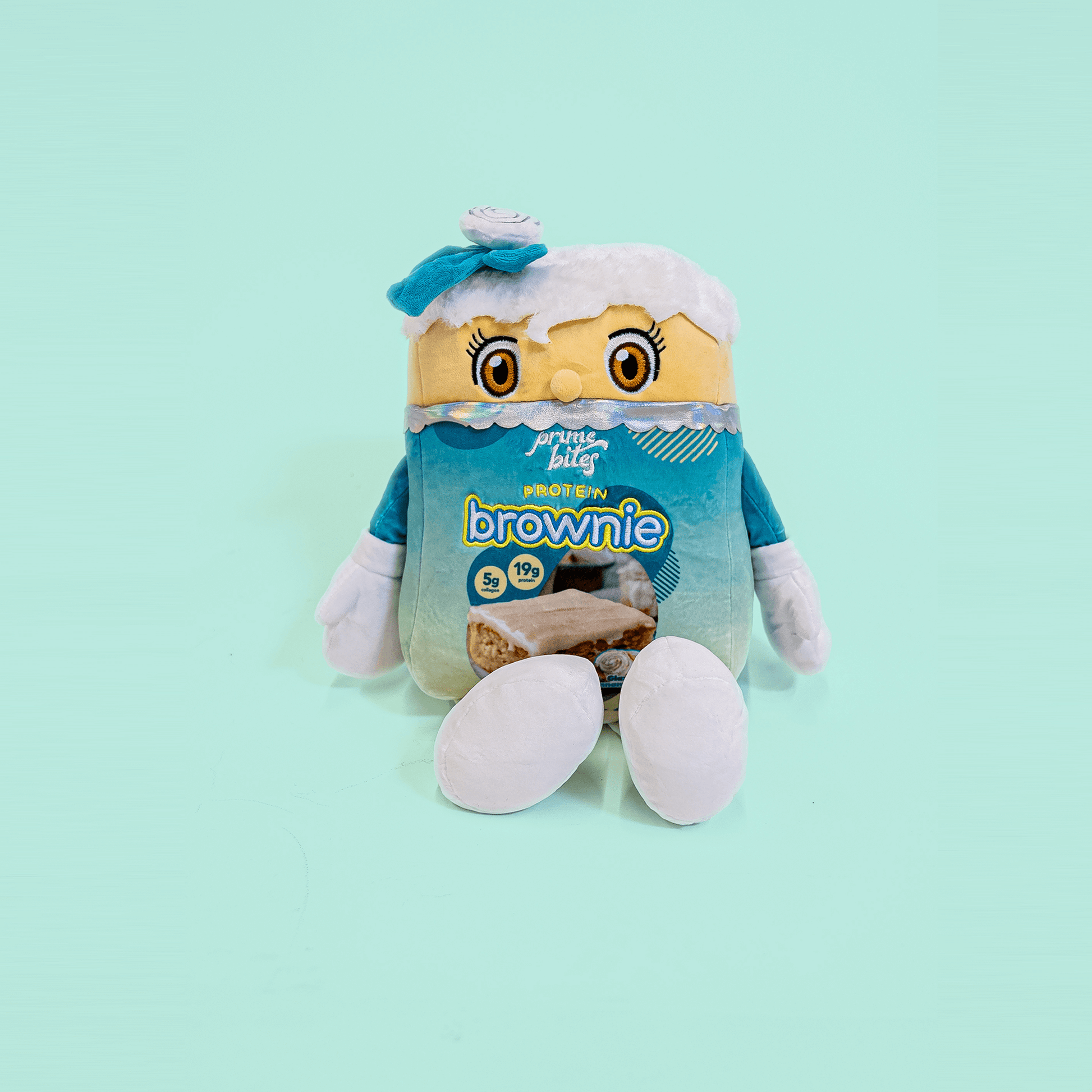 Prime Bites plushie pillow featuring a cute brownie character, perfect for snuggles and decor.