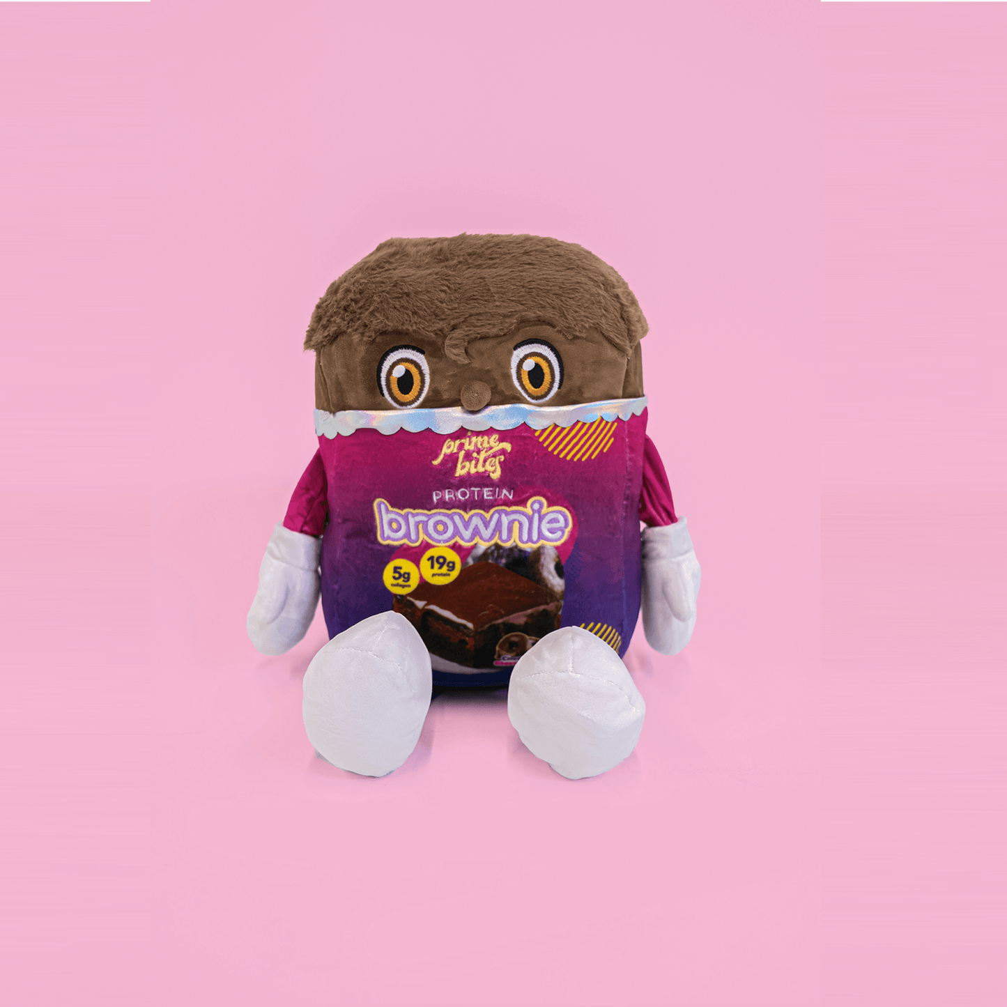 Prime Bites plushie pillow in brownie design, soft and cuddly with protein features, perfect for snuggling.