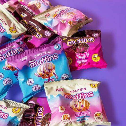 Colorful Mini Muffin variety pack from Prime Bites, featuring chocolate, blueberry, and birthday cake flavors, nutritious and delicious.