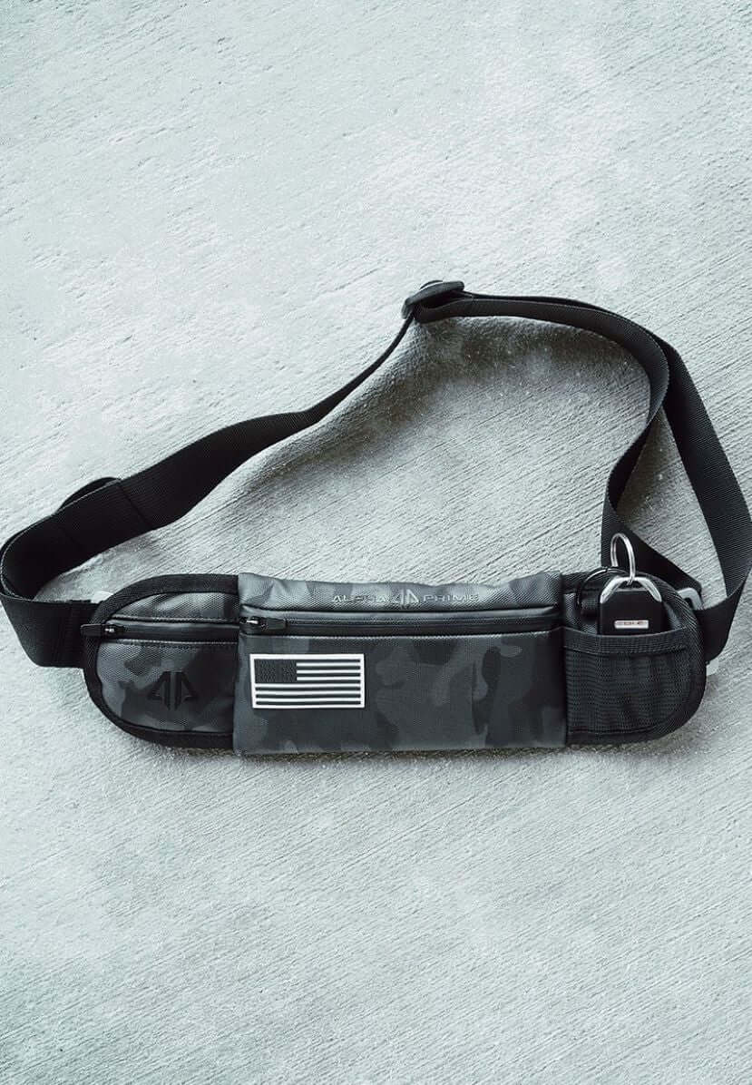 Black camo belt bag featuring an American flag design, ideal for stylish and functional everyday accessorizing.