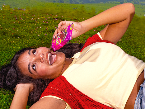 Woman enjoying a protein brownie outdoors