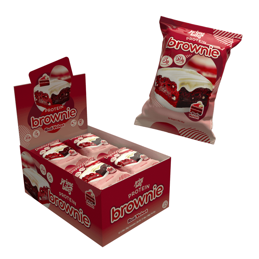 Open display box of 12 Prime Bites Red Velvet protein brownies with individually wrapped brownie packs and a single-pack pouch.