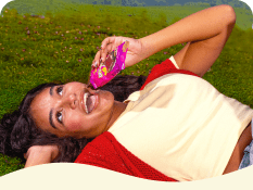 Woman enjoying a protein brownie outdoors